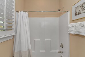 Combined shower/tub, hair dryer, towels, soap