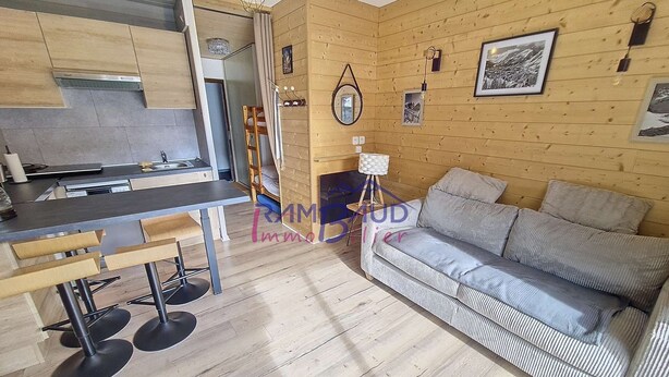 A compact living space with a kitchenette, a sofa, and a dining area. - Studio cabin   4 People  Resort center   Parking (VALLOIRE)