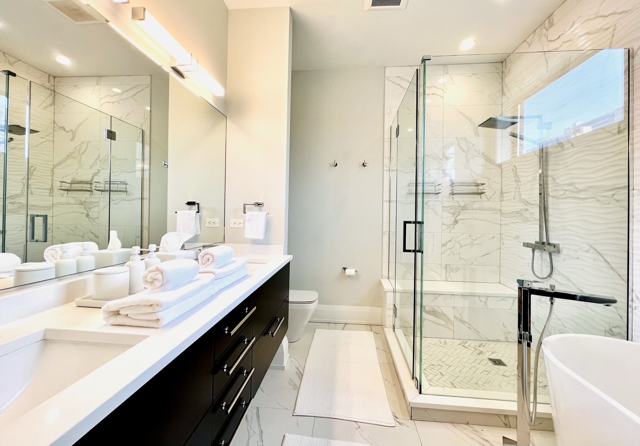 Bathtub, hair dryer, towels, soap