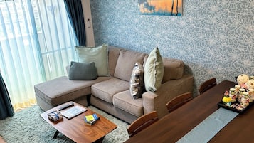 Deluxe Apartment, 2 Bedrooms | Living area | 20-inch flat-screen TV with cable channels, TV