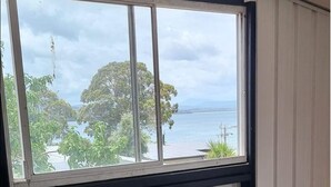 A window with a view of a body of water and trees. - Peaceful -Local Wine & Tamar River Views/Pets Allowed (Clarence Point)