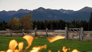 A wooden gate with a mountain backdrop. - Eagle Cap Farms hosted owned and operated by Eagle Cap Vacation Rentals (Joseph)