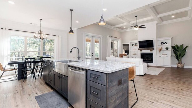 A spacious kitchen with a large island, modern appliances, and pendant lighting. - Luxe 3BR Family Stay | Fenced Yard | Prime WR (Kathleen)