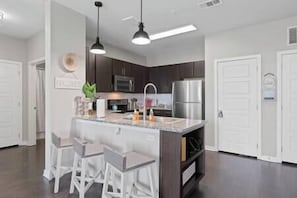 Fridge, coffee/tea maker, cookware/dishes/utensils - Austin's Serene Views w/ Large Balcony*Pool (Travis County)