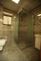 Economy Double Room Single Use, 1 Queen Bed, City View | Bathroom | Shower, rainfall showerhead, hair dryer, slippers