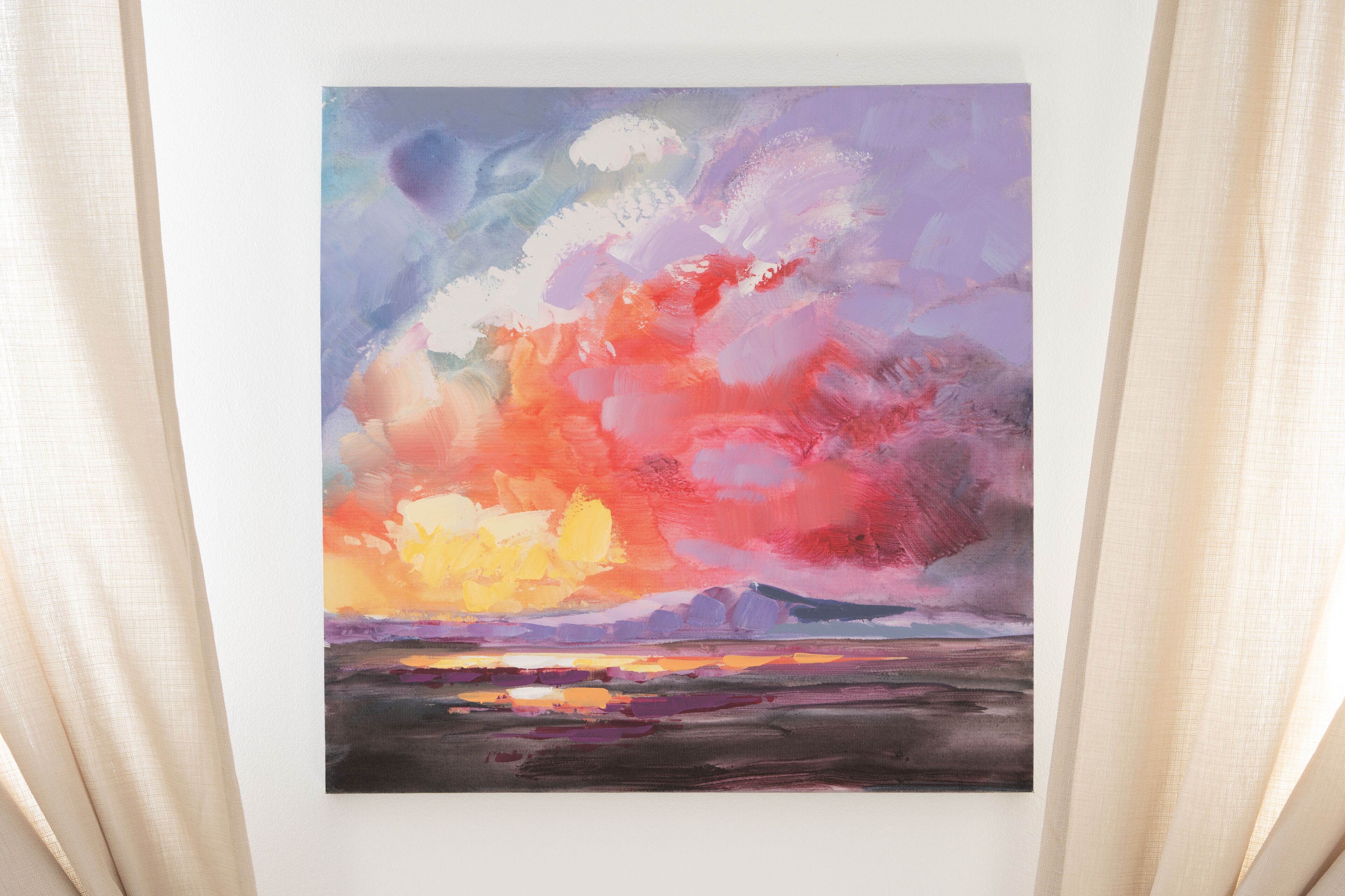 A painting of a sunset landscape with mountains in the background.