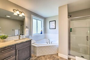 Bathtub, hair dryer, towels, soap