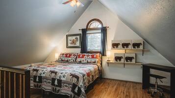 1 bedroom, desk, iron/ironing board, travel crib