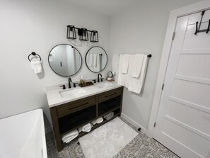 Bathtub, hair dryer, towels, soap - Remodeled-  Golf Course view (Brownsville)