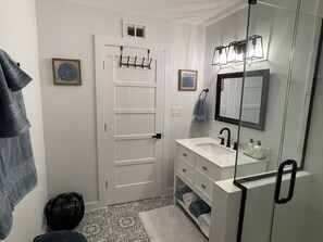 Bathtub, hair dryer, towels, soap