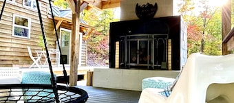 Luxury Tiny House with Treehouse Bedroom and HotTub on 34acres secluded