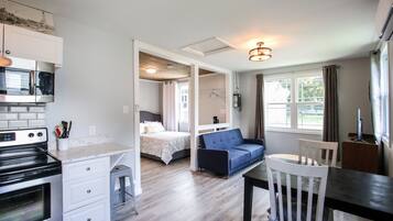 Deluxe House | Living area | 50-inch Smart TV with digital channels, TV, fireplace