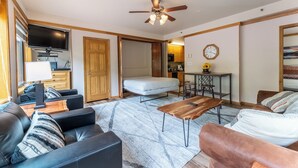 A modern living room with a sofa, coffee table, and a ceiling fan. - Slopeside #2775 by Summit County Mountain Retreats (Keystone)
