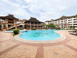 Outdoor pool - Modern 2BR Condo Near SM with Free Parking, Pool, WIFI, and Netflix (Davao City)