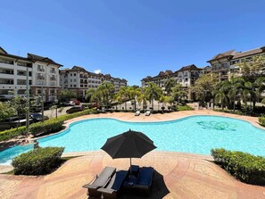 Outdoor pool - Modern 2BR Condo Near SM with Free Parking, Pool, WIFI, and Netflix (Davao City)