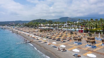 Sun-loungers, beach umbrellas, beach towels, beach volleyball