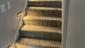 A carpeted staircase with built-in lighting. - Exotic Waterfront Getaway (Salem)