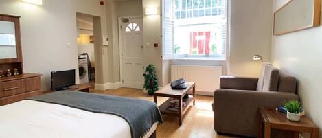 1 bedroom, desk, iron/ironing board, travel crib