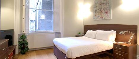 1 bedroom, desk, iron/ironing board, bed sheets