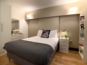1 bedroom, desk, iron/ironing board, travel crib