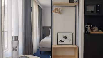Family Quadruple Room | Premium bedding, in-room safe, individually decorated, blackout drapes