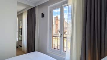 Family Quadruple Room | Premium bedding, in-room safe, individually decorated, blackout drapes