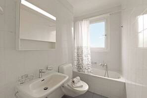 Combined shower/tub, hair dryer, towels, soap