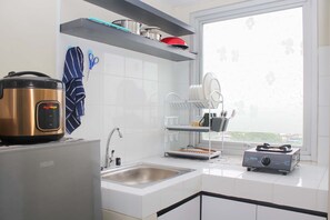 Private kitchen - Cozy Studio At Mont Blanc Apartment (Bekasi)