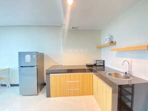 Apartment, 2 Bedrooms | Private kitchen | Fridge, stovetop, cookware/dishes/utensils - Spacious 2Br Apartment At El Royale Near Bip (Bandung)