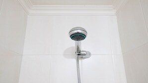 A shower with a handheld showerhead and a flexible hose. - Best Choice And Cozy Stay Studio At Puncak Kertajaya Apartment (Surabaya)