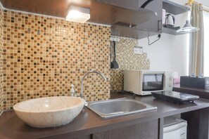 Fridge, stovetop, cookware/dishes/utensils - Nice And Cozy Studio At Signature Park Tebet Apartment (Jakarta)