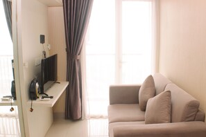 Living area - Cozy And Comfort Living 1Br At Oasis Cikarang Apartment (Cikarang)