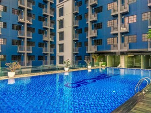 Outdoor pool - New And Nice Studio At Evenciio Margonda Apartment (Depok)