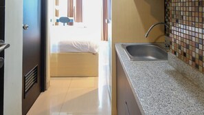 Private kitchen - Strategic And Cozy Studio At Tamansari Papilio Apartment (Surabaya)