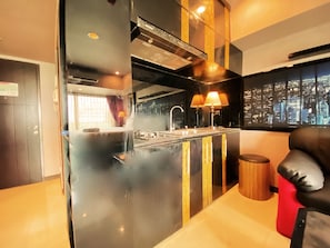 Studio | Private kitchen | Fridge, stovetop, cookware/dishes/utensils - Clean And Comfy Studio Room At Tamansari La Grande Apartment (Bandung)