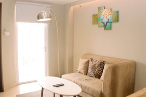 Apartamento, 1 quarto | Área de estar | TV