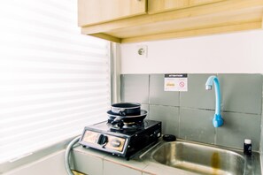 Departamento, 2 habitaciones | Cocina privada | Refrigerador, parrilla de estufa y utensilios de cocina 