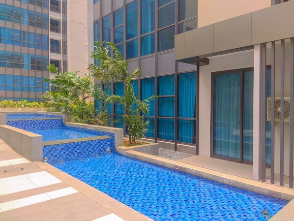 Outdoor pool - Nice And Comfort 2Br At Casa Grande Apartment (Jakarta)
