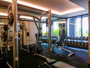 Work out in style with a fully equipped gym featuring exercise machines, free weights, and dumbbells.