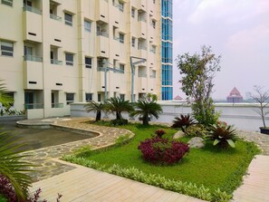 Experience the serene atmosphere of this hotel, surrounded by lush gardens and offering stunning views from the balconies.