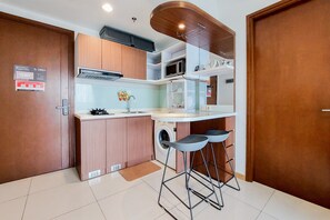 Apartment, 1 Bedroom | Private kitchen | Fridge, stovetop, electric kettle, cookware/dishes/utensils - Nice And Comfort 1Br Apartment At M-Town Signature (Gading Serpong)
