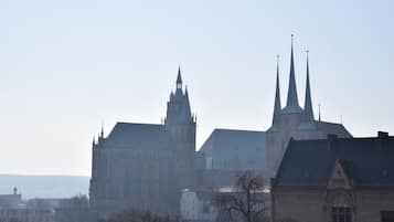 A historic building with multiple spires and a prominent central tower.