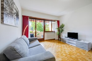 Standard Apartment, Multiple Bedrooms (Top Of The Spots) | Living area | 21-inch flat-screen TV with satellite channels, TV