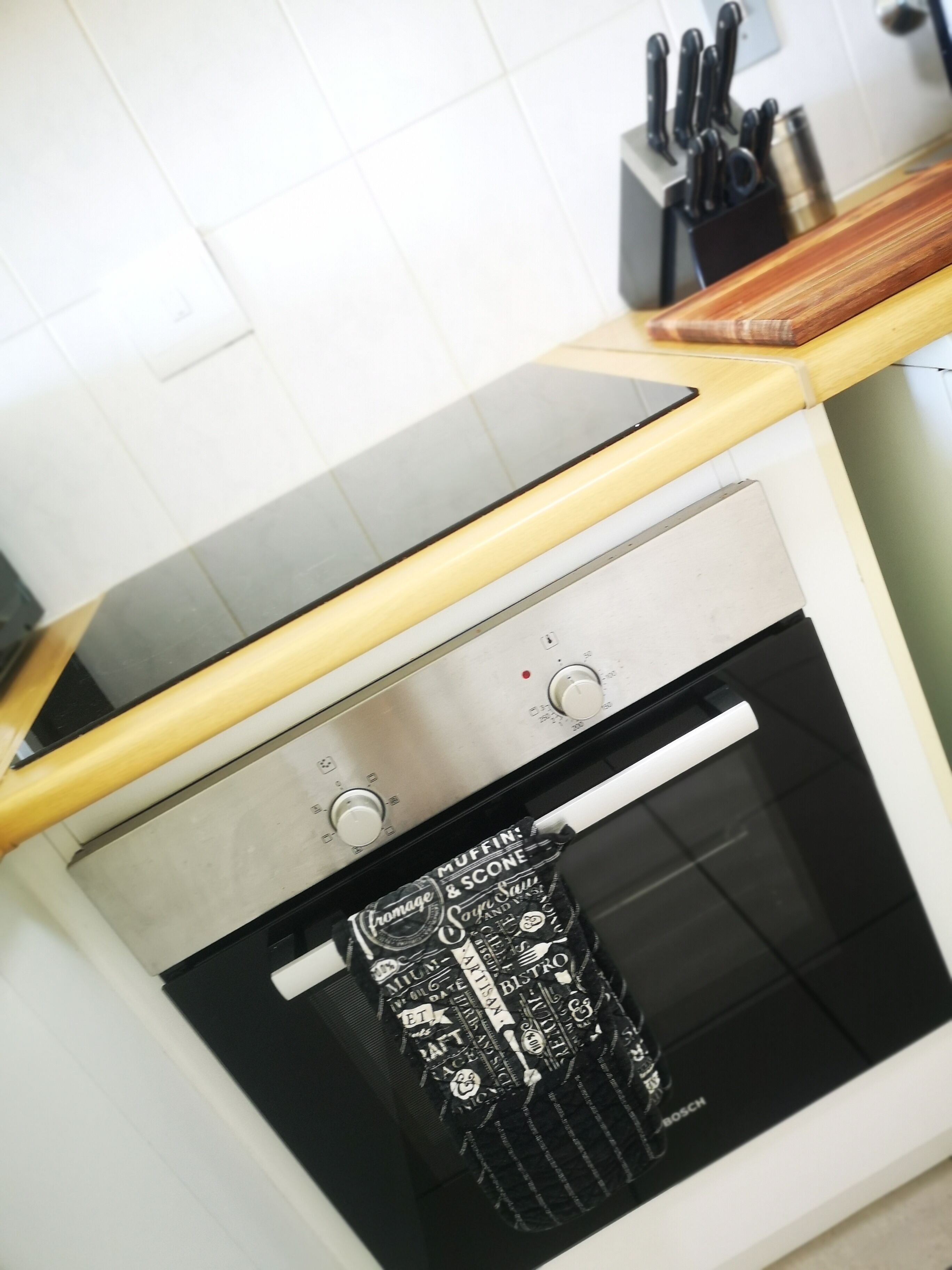 A kitchen with a built-in oven and a countertop.