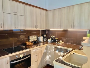 Enjoy cooking in this well-equipped kitchen with an oven, stovetop, and dishwasher.