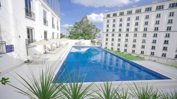 Outdoor pool, pool umbrellas, sun loungers