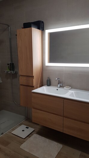 Bathtub, hair dryer, towels, soap