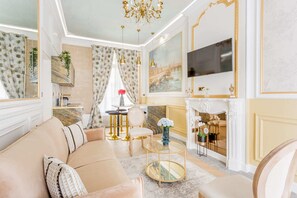 Relax in a stylish living room with a plush sofa, round coffee table, and comfortable seating area.