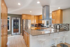 Fridge, microwave, oven, stovetop - Perch - Phinney Guest House: Spacious 3BR | Downtown Fremont | Parking (Seattle)