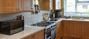 A seaside delight having a sandy beach, shops and pubs all nearby.